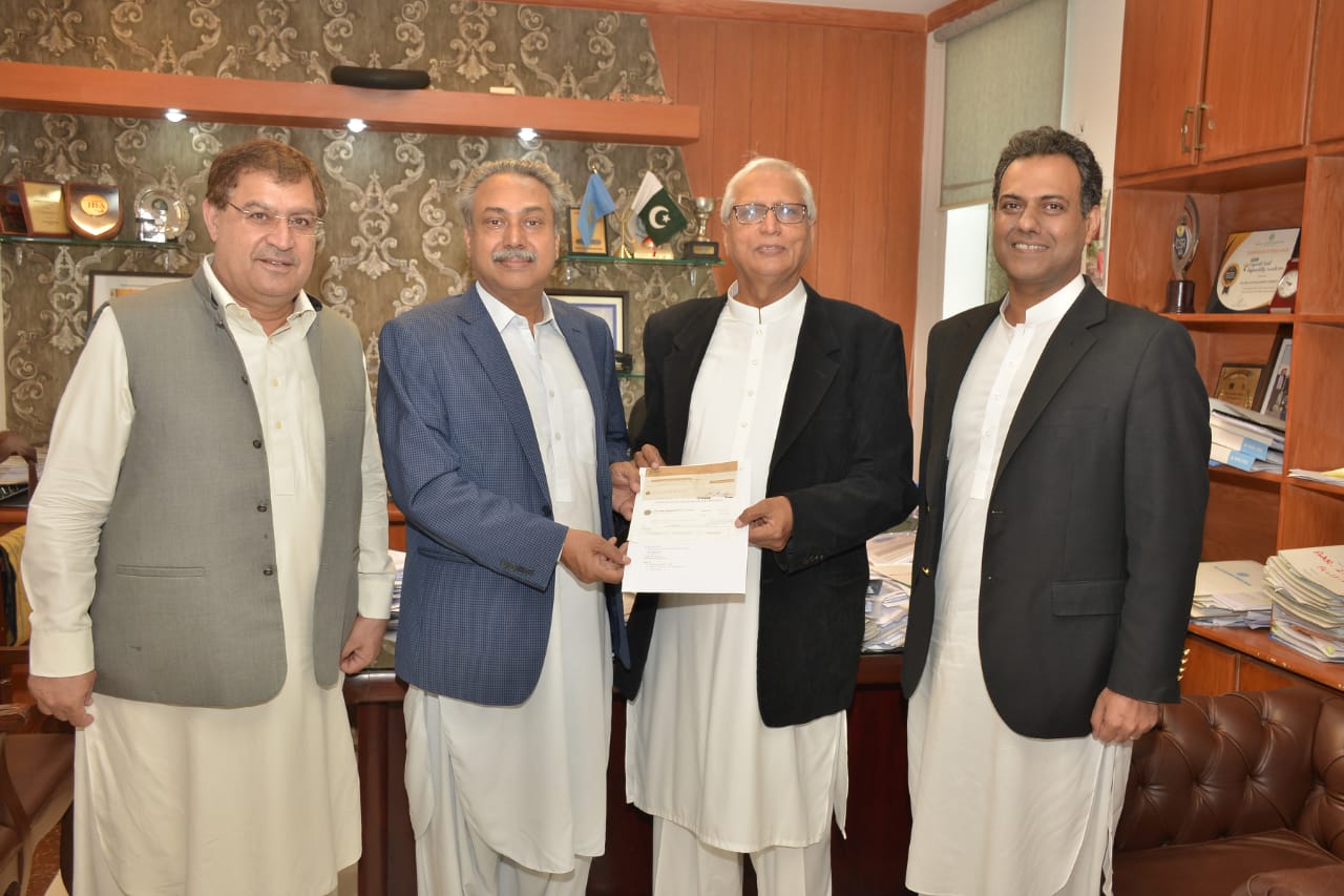 Cheque presentation ceremony by Mr. Salim Baz Khan GM CSR of OGDC
